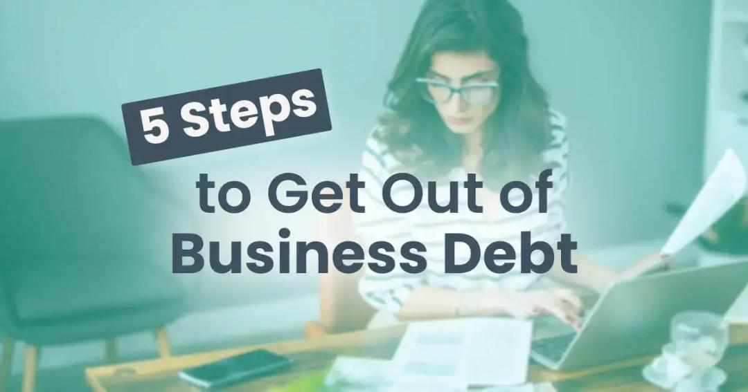 Woman working on a laptop with documents, beside text "5 steps to get out of business debt.