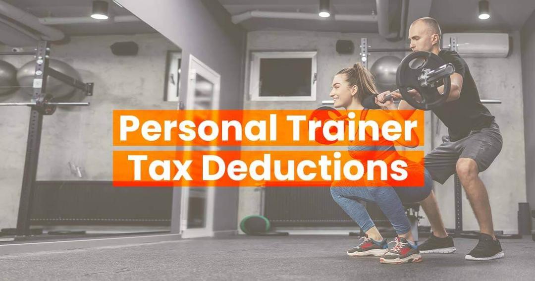 Young woman performing a back squat with her personal trainer there for support.