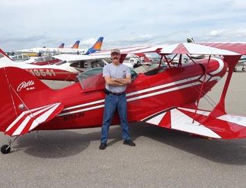 Man standing in front of an airplane
